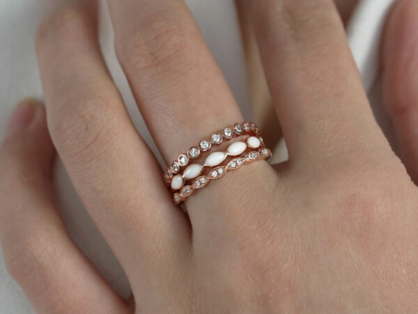 breast milk three rings set fine bands rose gold plated from keepsakemom on a model hand