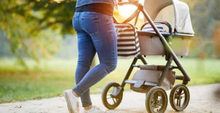 Mom on a walk with baby in a stroller