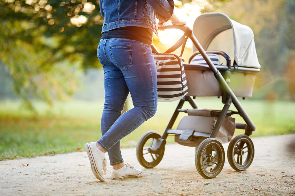 Mom on a walk with baby in a stroller