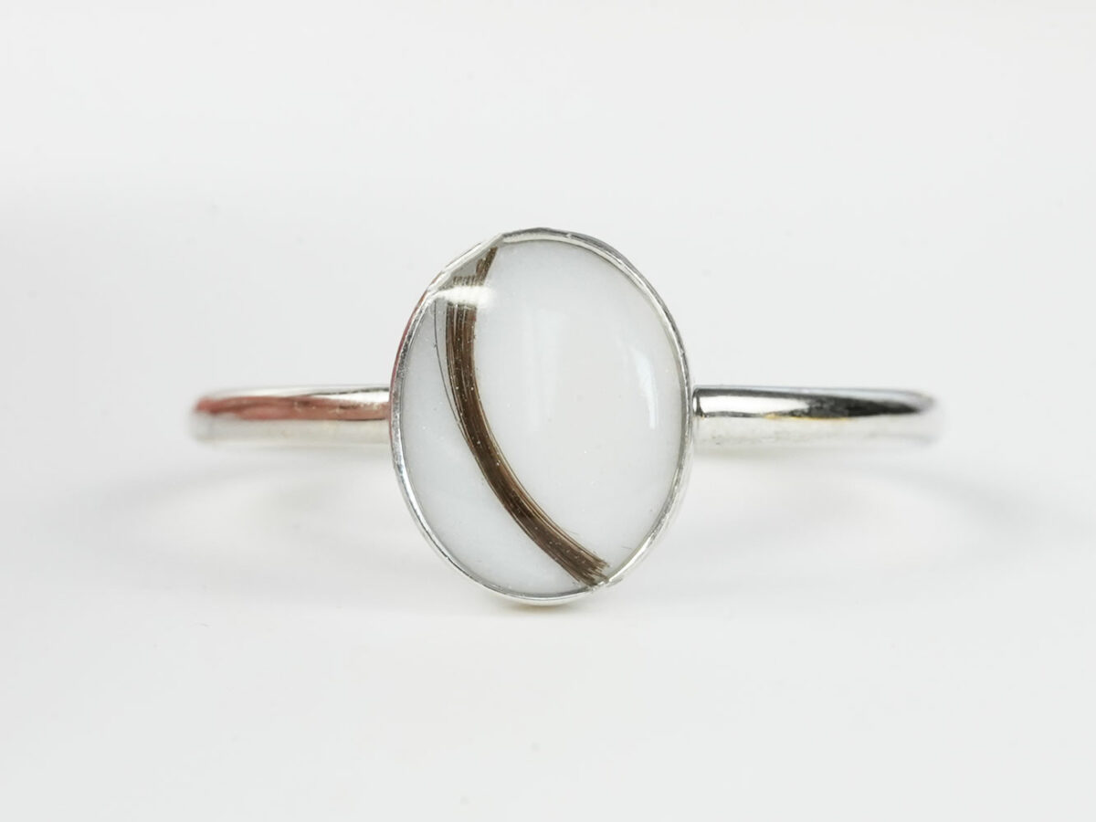 white gold plated sterling silver oval-shaped breast milk ring with hair from KeepsakeMom