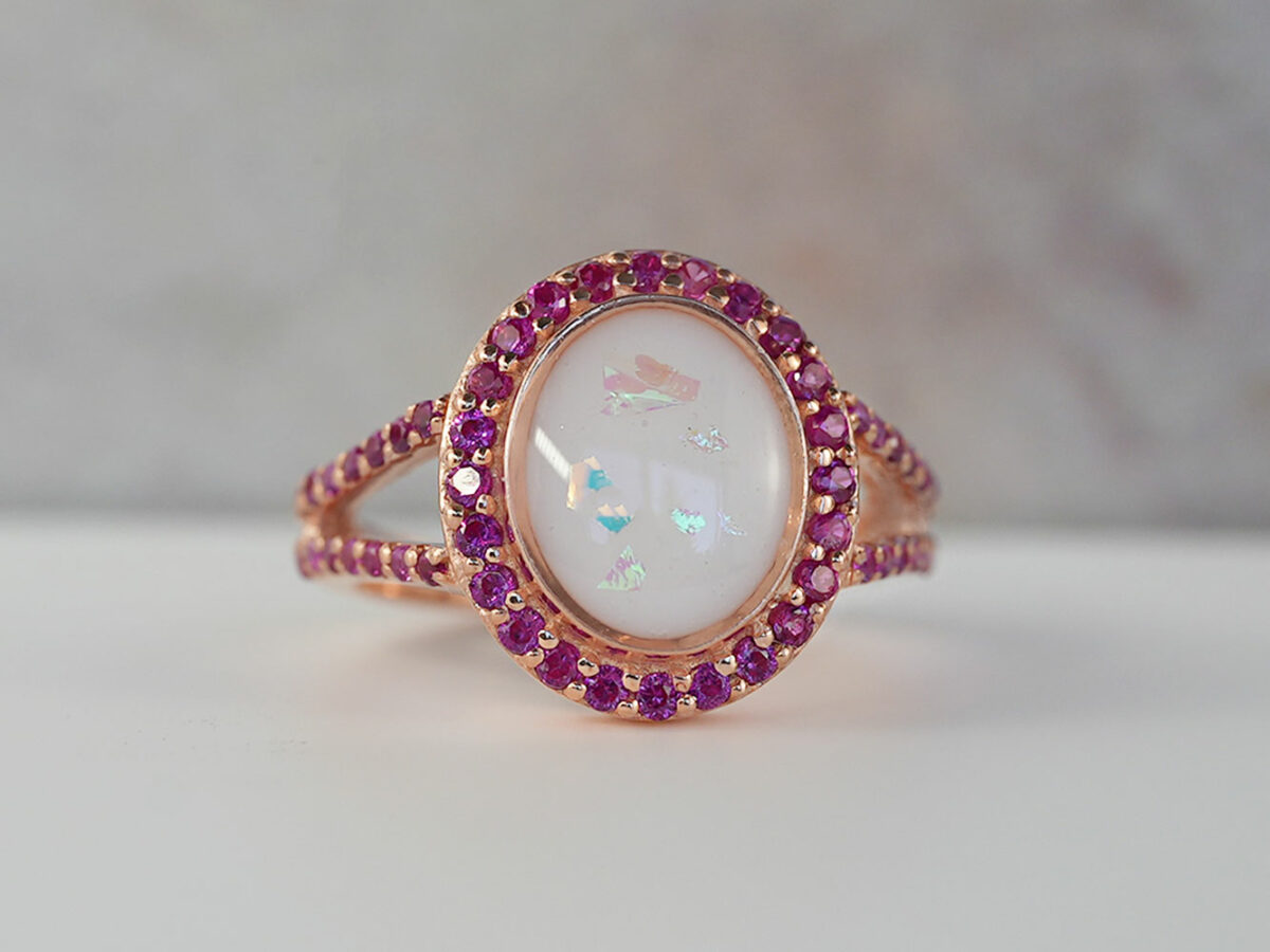 breastmilk jewelry oval ring crystals ruby birth month color around oval breastmilk stone from KeepsakeMom