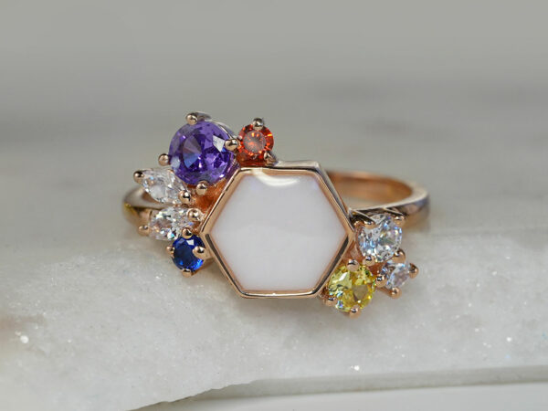 breastmilk ring in hexagon shape milk and honey with different birth month color crystals on each side from keepsakemom
