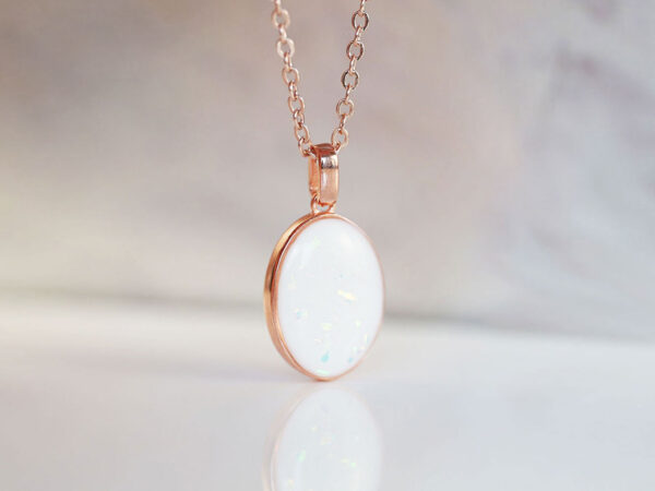 breastmilk jewelry oval necklace with opal flakes, hair and charm for DIY kit from KeepsakeMom in rose gold