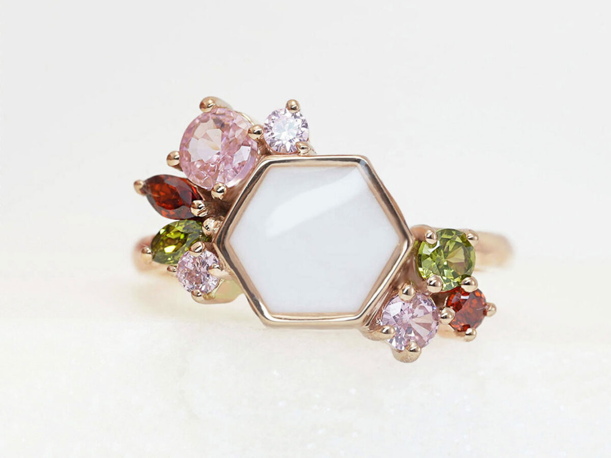 breastmilk ring in hexagon shape milk and honey with different birth month color crystals on each side from keepsakemom