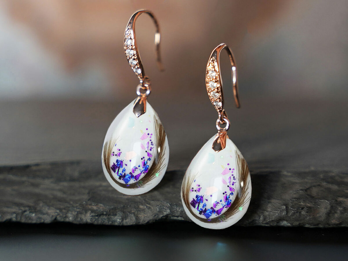 breastmilk jewelry drop fancy earrings KeepsakeMom sterling silver plated rose gold with crystals and hair and blue flakes imbedded in drop shaped breastmilk stones