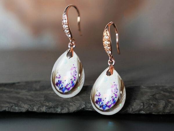 breastmilk jewelry drop fancy earrings KeepsakeMom sterling silver plated rose gold with crystals and hair and blue flakes imbedded in drop shaped breastmilk stones
