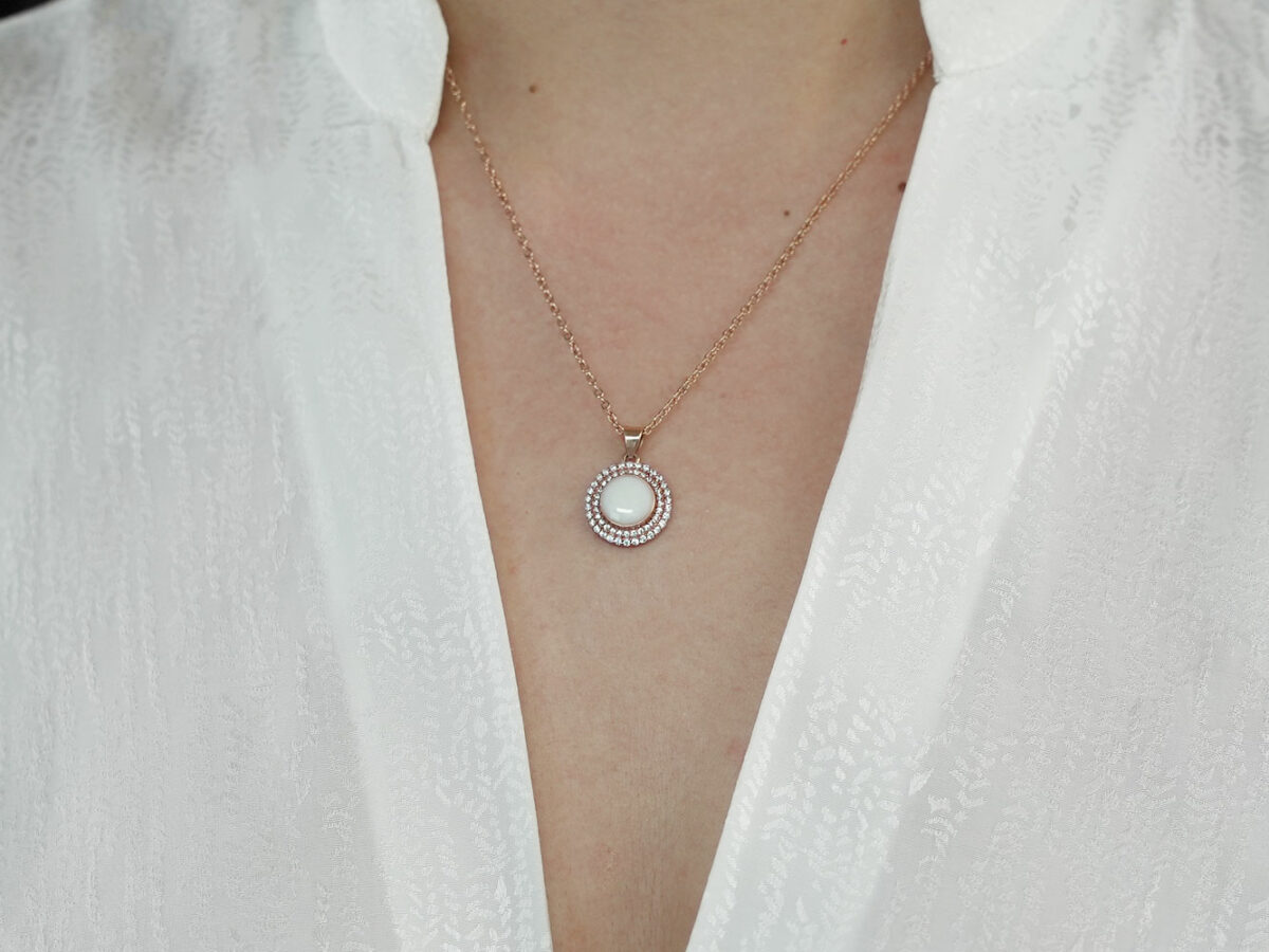 breastrmilk jewelry disc necklace flower sun birth month color crystals KeepsakeMom custom on model chest