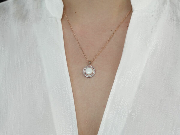 breastrmilk jewelry disc necklace flower sun birth month color crystals KeepsakeMom custom on model chest