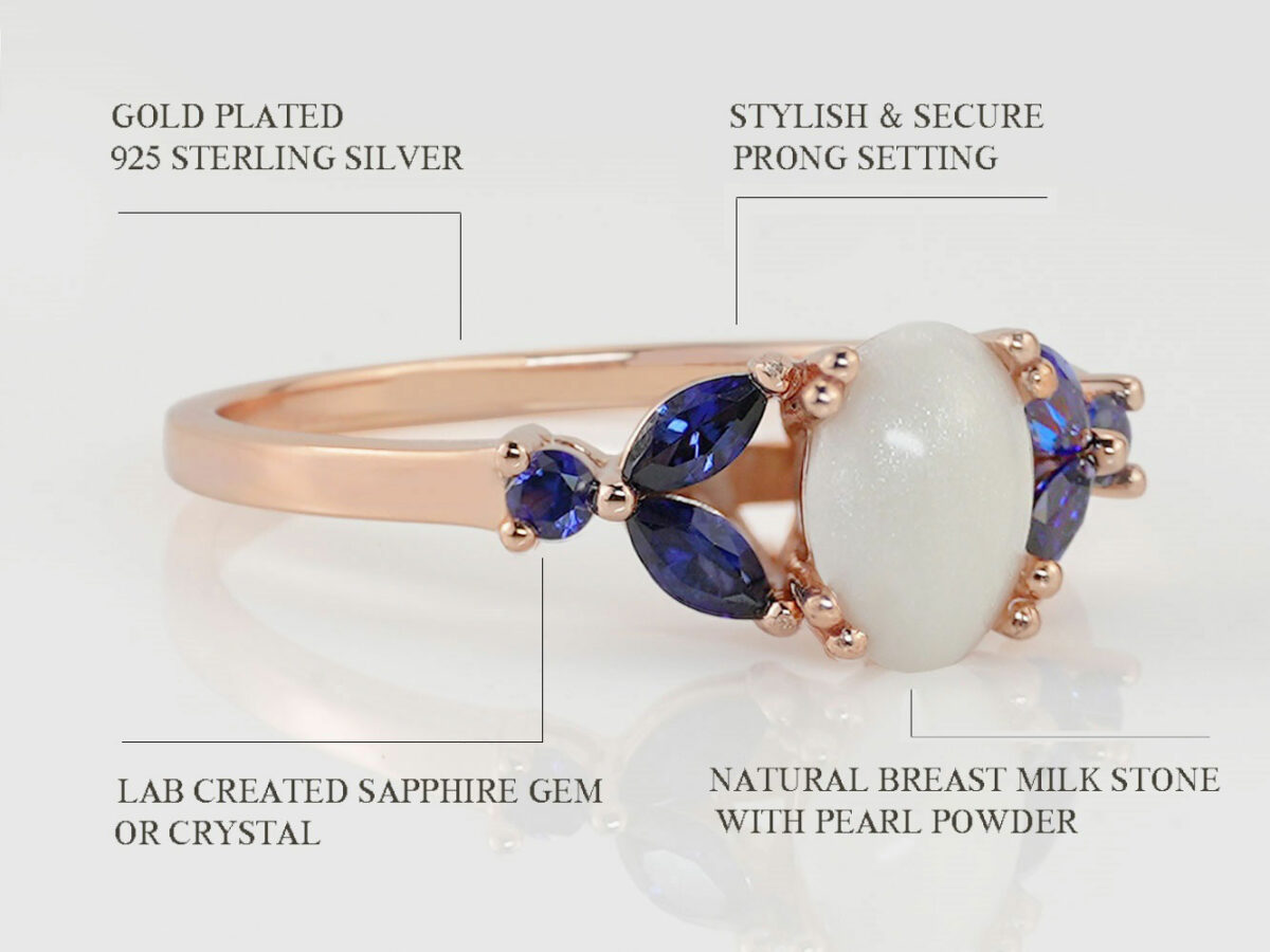 breast milk ring with oval stone and three sapphire crystals or gems on each side in rose gold setting from KeepsakeMom