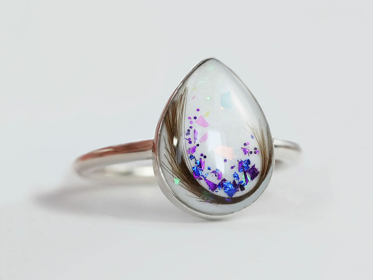 sterling silver teardrop ring, breast milk stone with february/june birth month flakes and hair from KeepsakeMom
