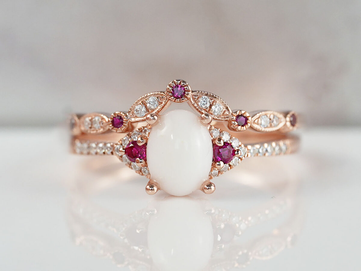 breastmilk jewelry fine ring set with birth month color gems and oval breastmilk stone KeepsakeMom rose gold ruby red crystals in rose gold setting