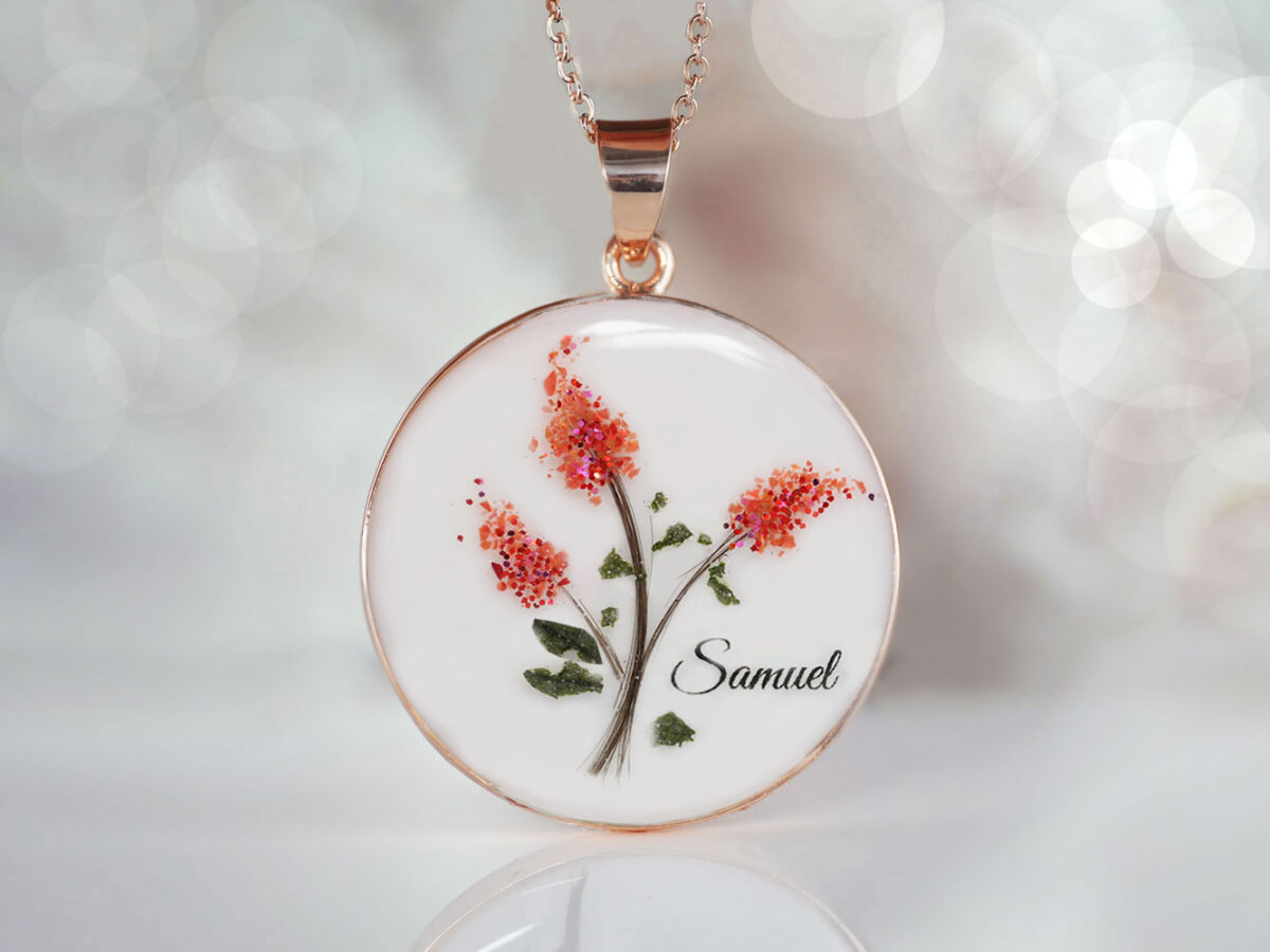 breastmilk jewelry disc necklace with lock of hair making red lilacs stems with red gems and shimmers to make flowers with baby name from keepsakemom