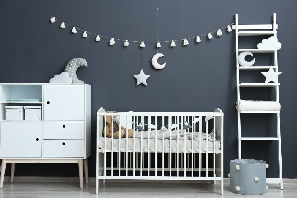 A baby nursery with moon and stars décor.
