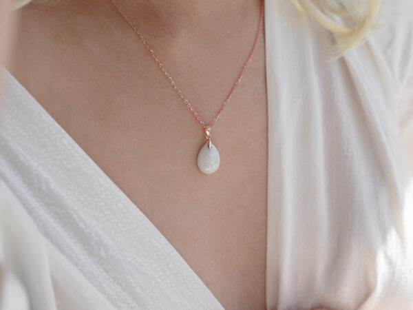 Breastmilk jewelry necklace pendant drop teardrop shape with opal real gems crushed from KeepsakeMom on a model