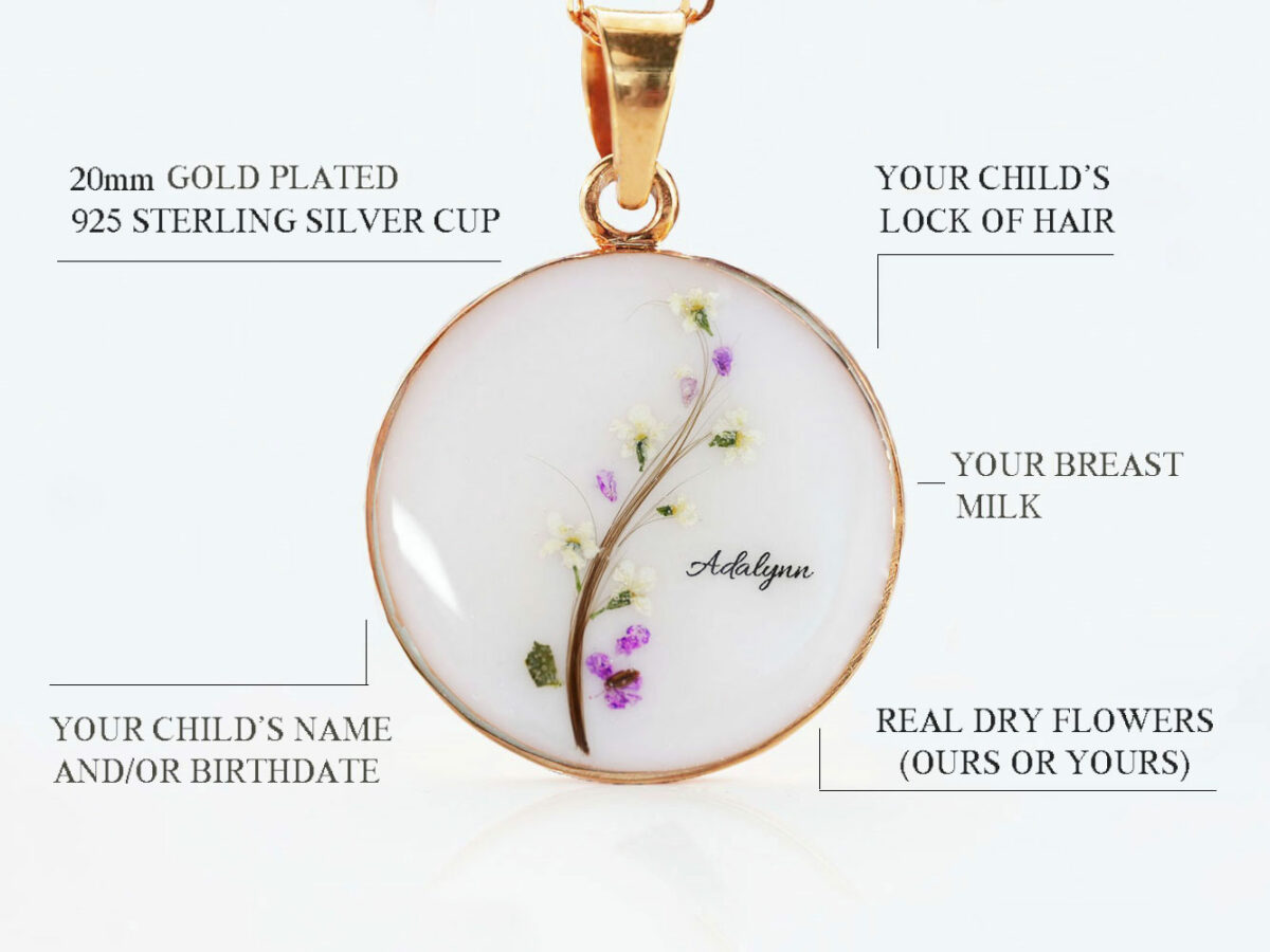 breast milk disc round shaped necklace filled with breast milk and fin e branch made with lock of hair and real dry flowers as leaves green, white and hot and pink shimmers and baby foot prints and names on white background describing features diagram from keepsakemom
