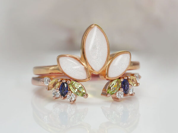 breastmilk jewelry ring leaves three stones lotus like from KeepsakeMom rose gold two-ring setting with peridot, citrine, clear, and sapphire crystals on the add-on ring on the bottom