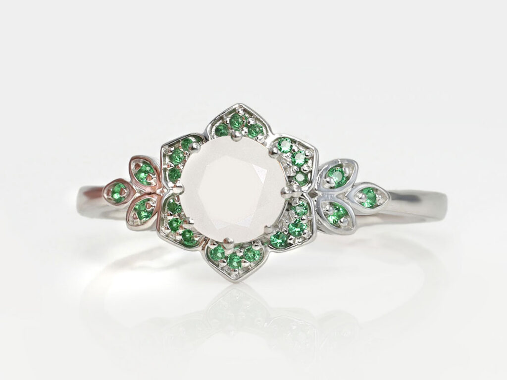 breastmilk jewelry ring with may emerald birth month color crystals gems around breastmilk central stone from keepsakemom