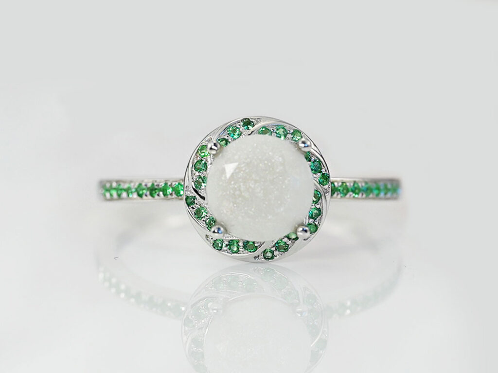 breastmilk jewelry ring with may emerald birth month color crystals gems around breastmilk central stone from keepsakemom