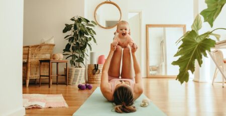 Mom doing gentle exercises with baby