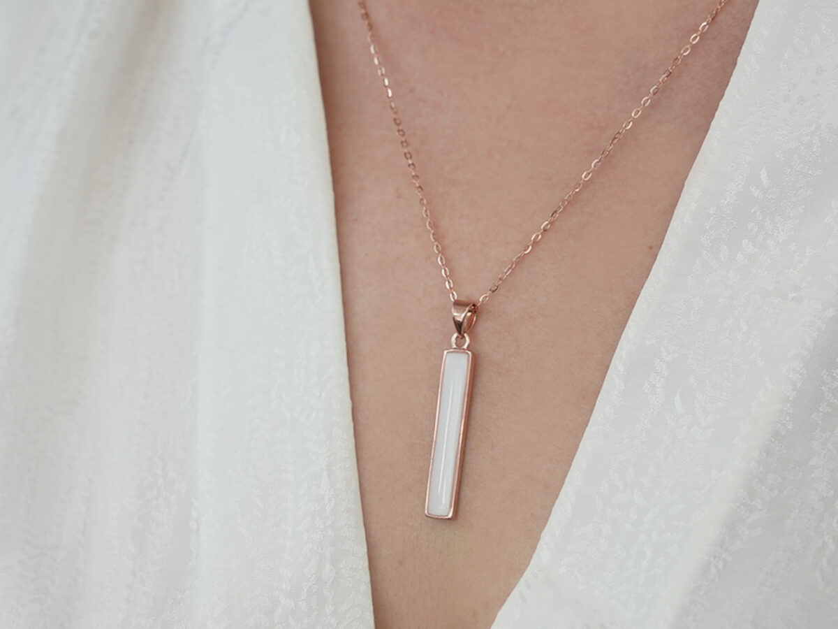 breastmilk bar simple necklace in rose gold on model chest
