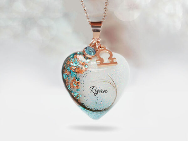 breastmilk jewelry blue baby boy heart with hair and name of baby with light blue, sky blue charm and zodiac charm with baby blue flakes and shimmers and opal gems from keepsakemom