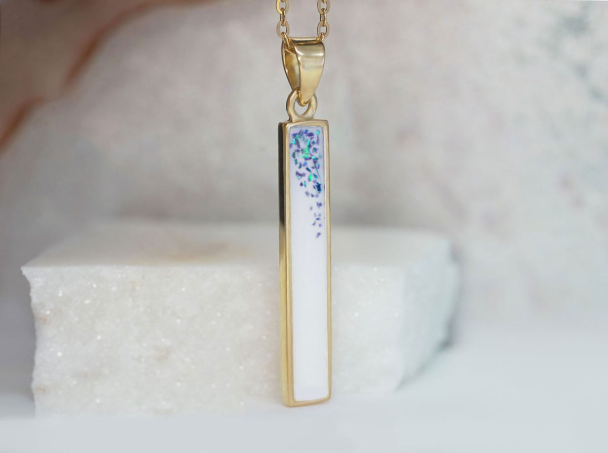 breastmilk jewelry long bar stick filled with milk in rectangular shape vertical from Keepsakemom in silver yellow gold plated with sapphire opal gems on top inside breastmilk