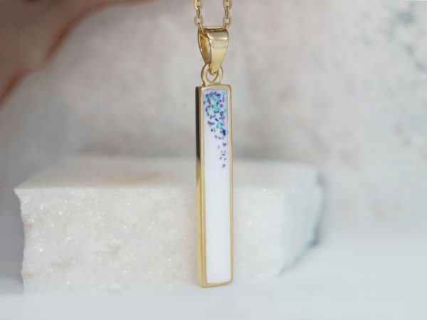 breastmilk jewelry long bar stick filled with milk in rectangular shape vertical from Keepsakemom in silver yellow gold plated with sapphire opal gems on top inside breastmilk