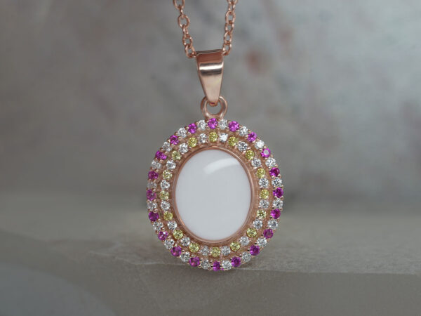 breastrmilk jewelry oval necklace with double halo of birth month color crystals from KeepsakeMom in rose gold with clear , yellow and hot pink alternating