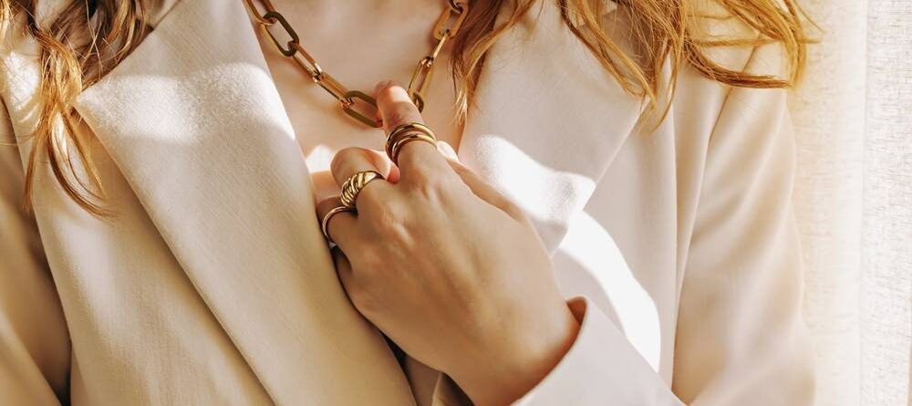 Close-up of woman wearing gold jewelry
