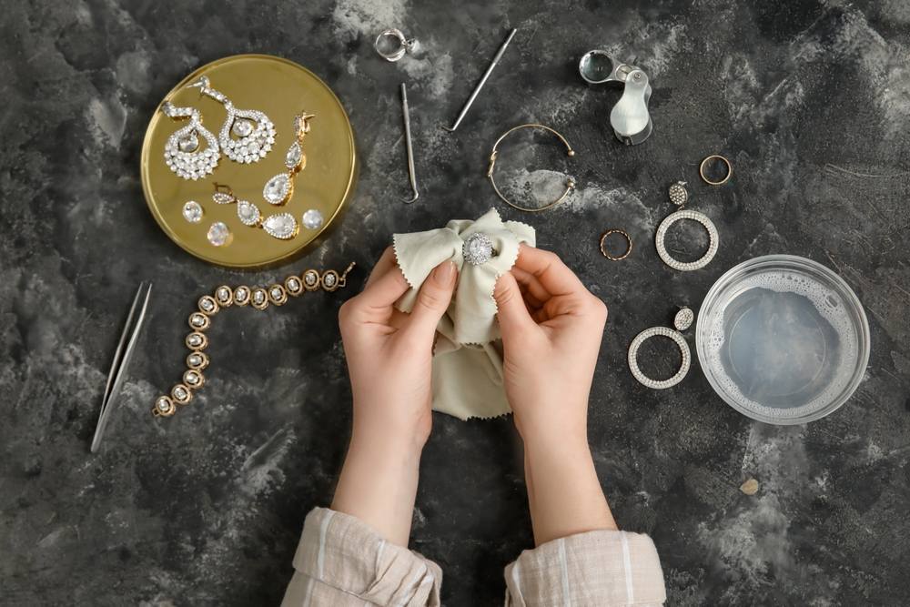 Woman cleaning her fine jewelry