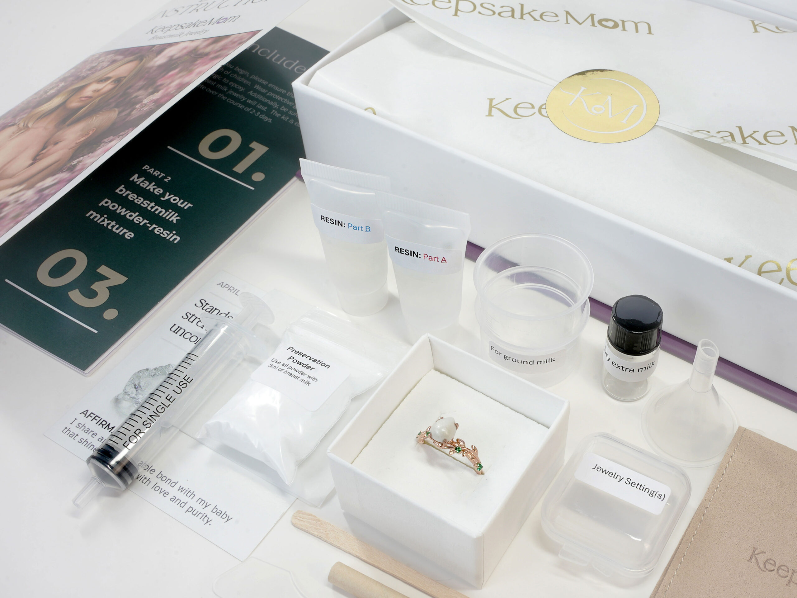 Breastmilk Jewelry DIY Kit KeepsakeMom Box Contents (1)32 breastmilk jewelry DIY kit from KeepsakeMom contents and items instructions stirring and measuring tools settings resin and storage bottle for breast milk