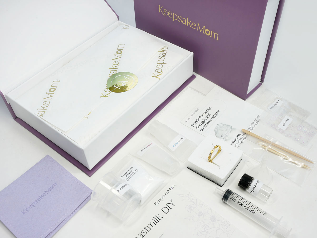 Breastmilk Jewelry DIY Kit KeepsakeMom Branded (7) breastmilk jewelry DIY kit box open contents with golden logo KeepsakeMom and purple box