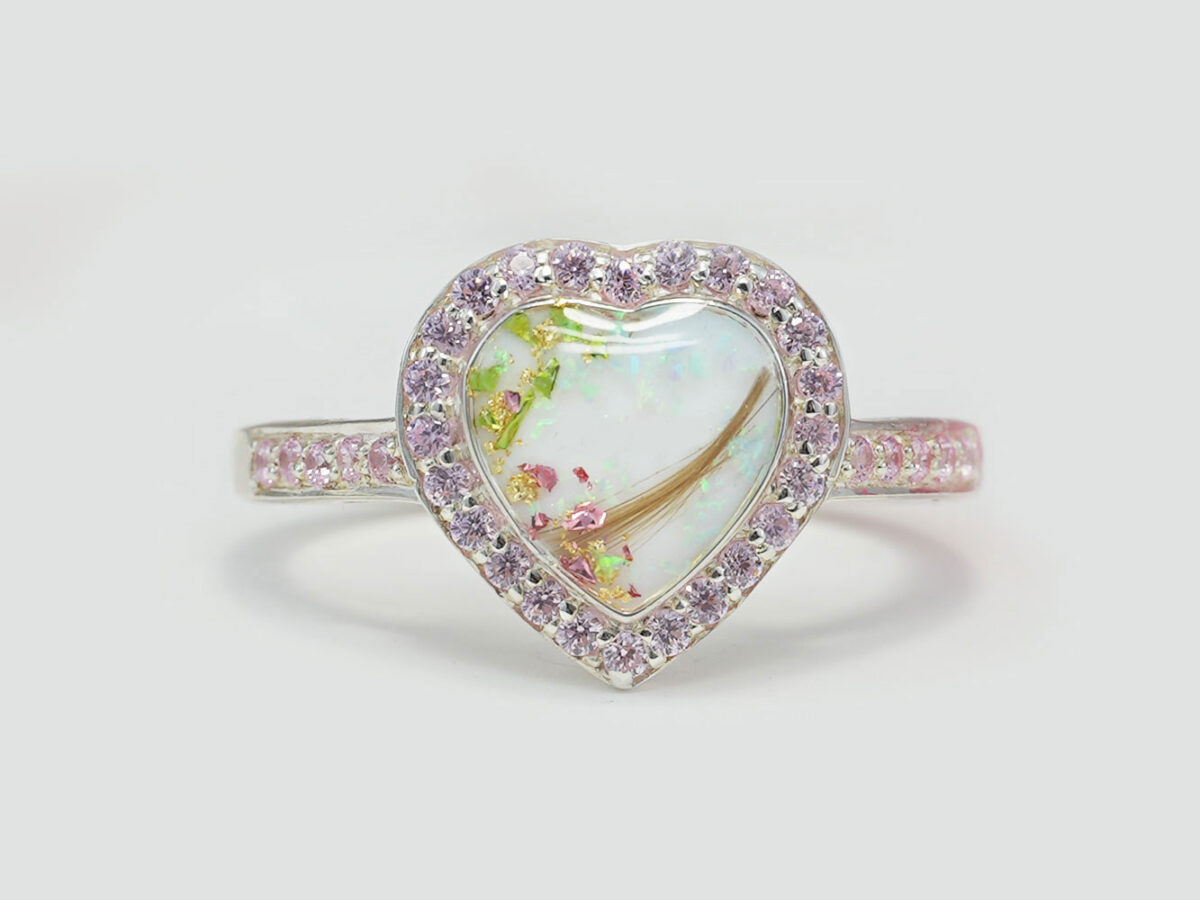 breastmilk ring in heart shape with halo crystals , hair and colored flakes inside breastmilk stone for diy kit keepsakemom