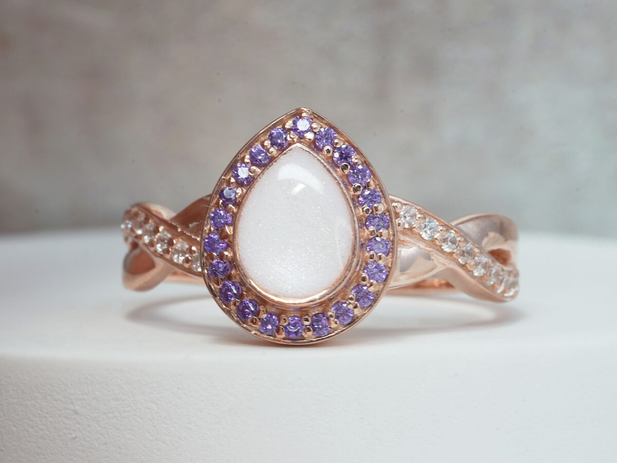 breastmilk ring for DIY KIT rose gold teardrop shaped with purple crystals around the band and stone halo from keepsakemom