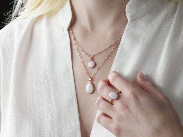breastmilk-jewelry-necklace-simple-shape from keepsakemom for diy kit on a model chest