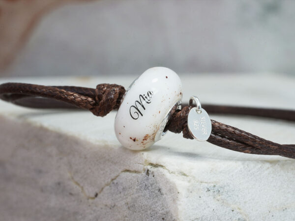 breastmilk jewelry bracelet bead with placenta, umbilical cord and ashes with baby's name on it with brown cord from keepsakemom