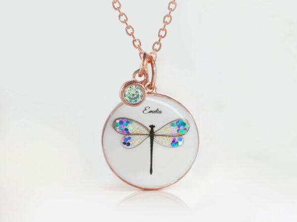 breastmilk jewelry round disc necklace filled with breastmilk and dragonfly with wings made from baby's hair and filled with blue shimmer and flakes. keepsake in rose gold metal cup and chain from keepsakemom
