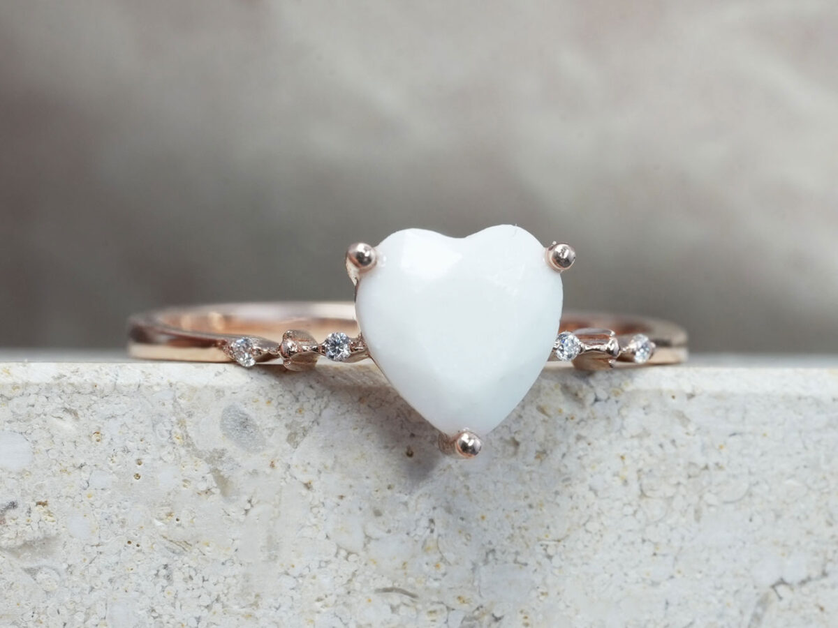 breastmilk jewelry ring in sterling silver rose gold plated with fine band and crystals on each side with heart shaped breastmilk stone front view from KeepsakeMom