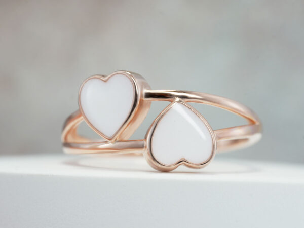 two hearts rose gold breastmilk ring on grey background from keepsakemom