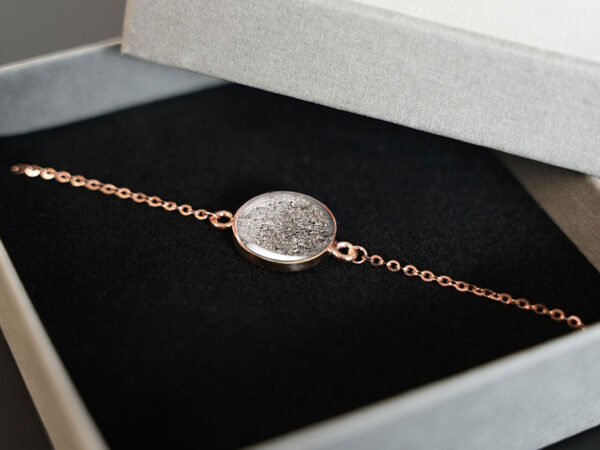 horse memorial bracelet filled with animal's ashes for a pet owner, a rose gold disc bracelet with rose gold chain from keepsakemom