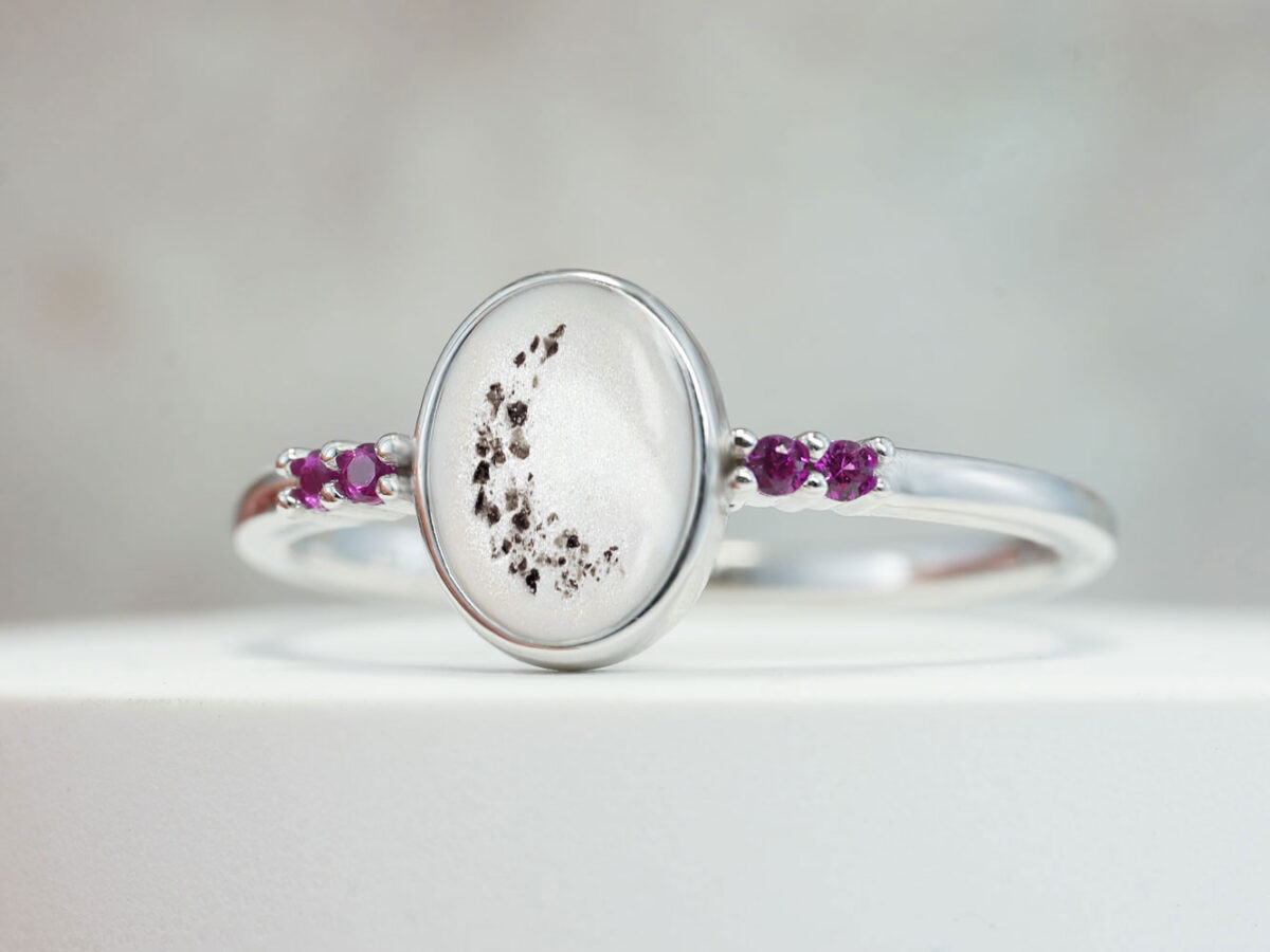 Breastmilk Oval Silver Ring Four Gems Keepsakemom breastmilk jewelry sterling silver oval ring with breast milk and memorial ashes with four colored crystals ruby red and pink in white gold from keepsakemom