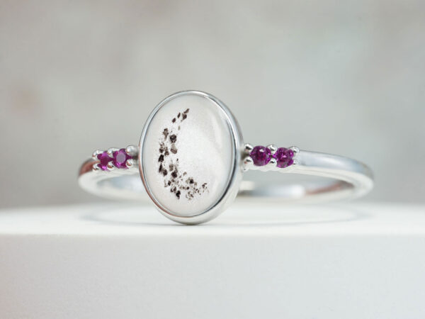 breastmilk jewelry sterling silver oval ring with breast milk and memorial ashes with four colored crystals ruby red and pink in white gold from keepsakemom