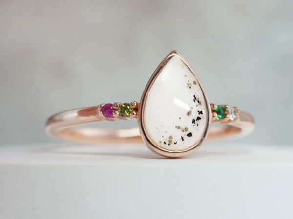 breastmilk jewelry sterling silver plated rose gold teardrop ring with breast milk and memorial ashes with four colored crystals ruby red and pink, green and peridot in rose gold from keepsakemom