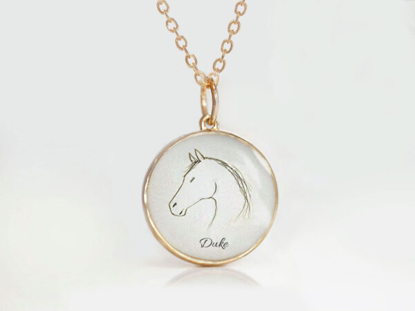 memorial rose gold necklace for a horse lover, showing the horse outline made from a pet's fur or hair with a name printed underneath from keepsakemom