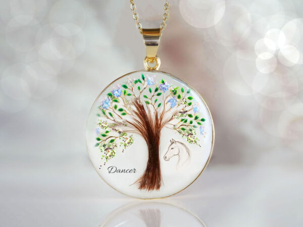 memorial jewelry, a pendant with a tree formed from the pet's hair with shimmer and flakes, an image of a horse printed on the right side of the tree from keepsakemom