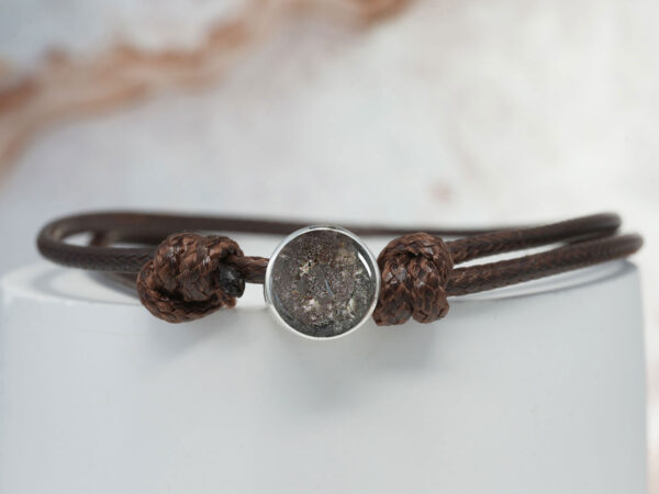 pets memorial jewelry bracelet from keepsakemom with silver disc filled with cat/feline ashes with brown bracelet cord