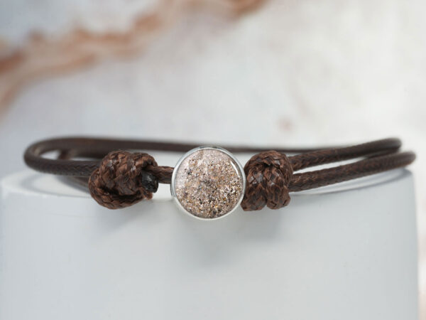 pets memorial jewelry bracelet from keepsakemom with silver disc filled with dog/canine ashes with brown bracelet cord