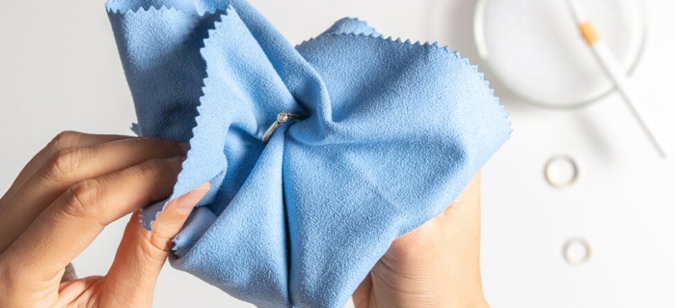 A person polishing a ring