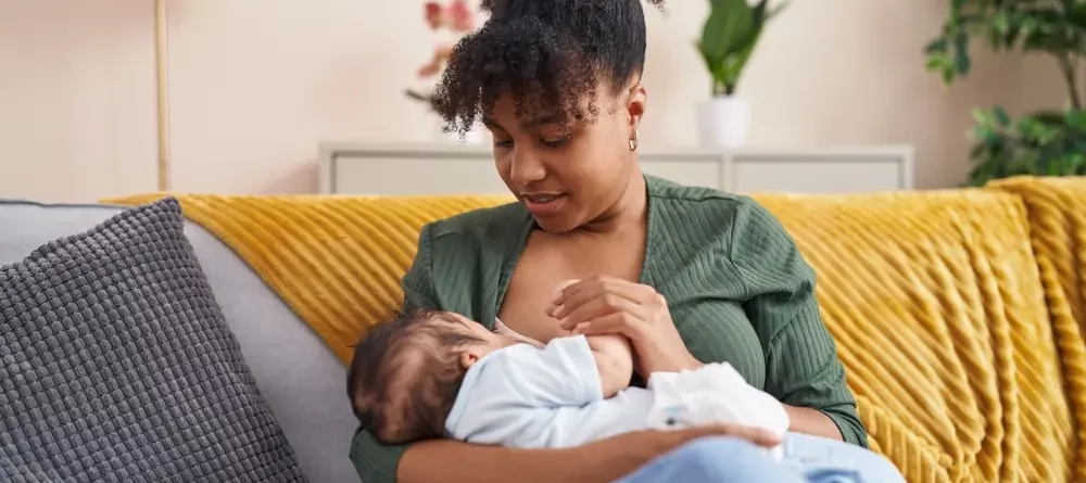 A mother about to breastfeed her child