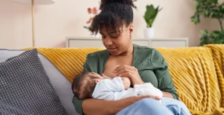 A mother about to breastfeed her child